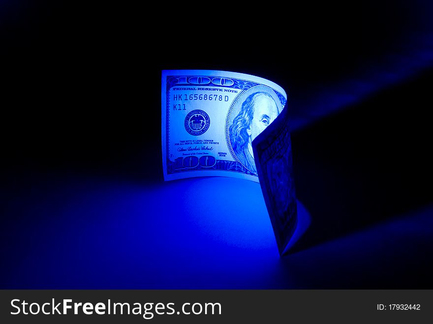 Hundred dollars. 
Beautiful art illumination. A dark blue background. Hundred dollars. 
Beautiful art illumination. A dark blue background.