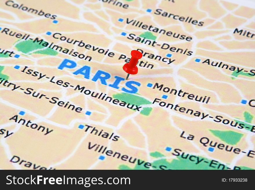 A paris map with a push pin