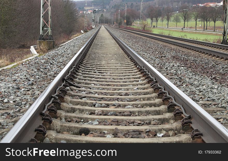 Railways on a stone platform, rails, road