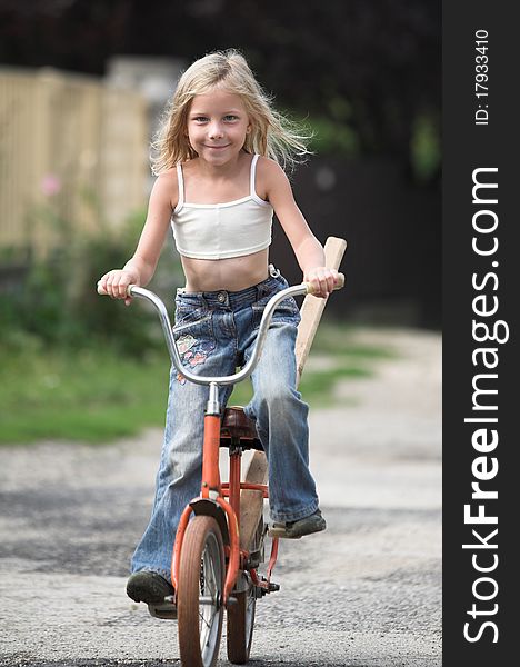 Summer vacation, little girl rides bicycle. Summer vacation, little girl rides bicycle
