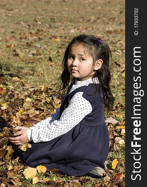 Young Asian Girl And Autumn Leaves