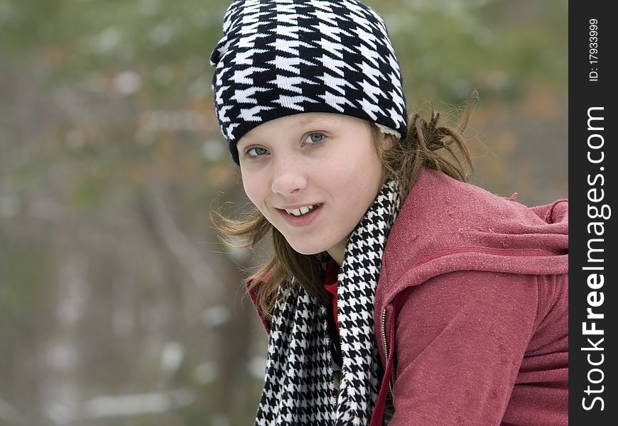 Young girl outside in the winter snow. Young girl outside in the winter snow