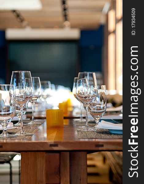 Wooden Dining Table And Wine Glasses