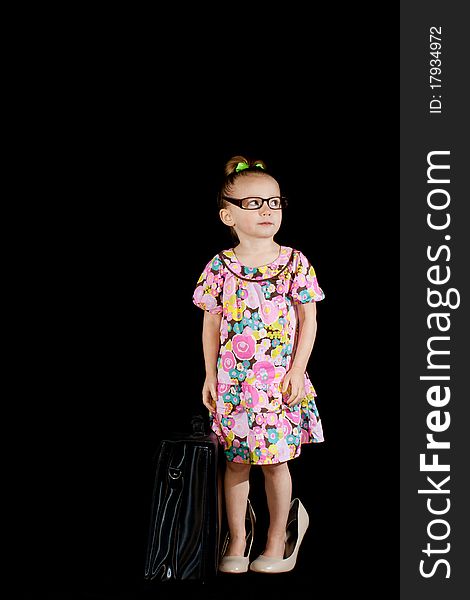 A cute little girl dressed up like an adult. She is wearing full sized shoes, adult glasses and has a briefcase to add to the cuteness factor!. A cute little girl dressed up like an adult. She is wearing full sized shoes, adult glasses and has a briefcase to add to the cuteness factor!