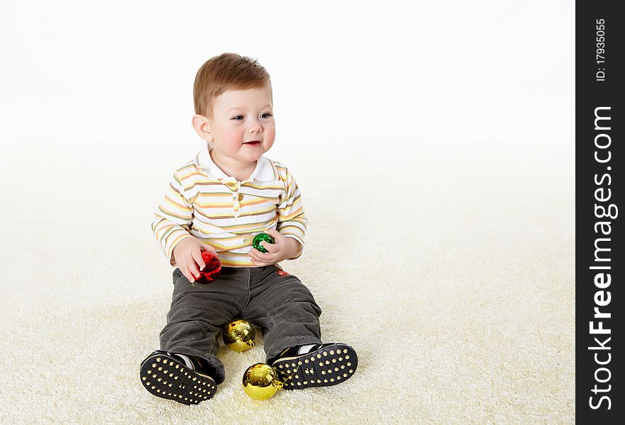 Happy smiling little boy playing on the floor. Happy smiling little boy playing on the floor