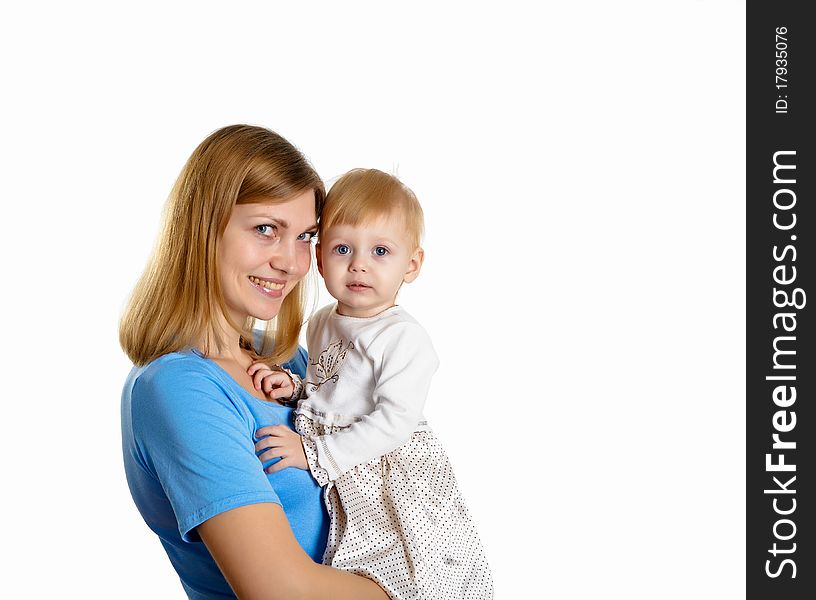 Young mother having fun with her little son on the floor