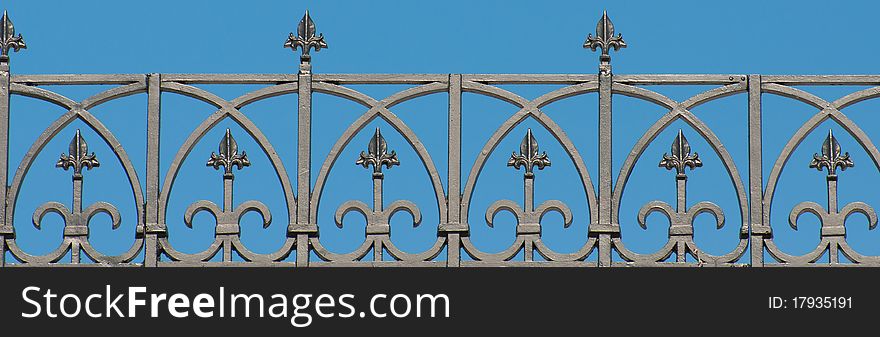 Gohic iron ornaments against blue sky. Gohic iron ornaments against blue sky