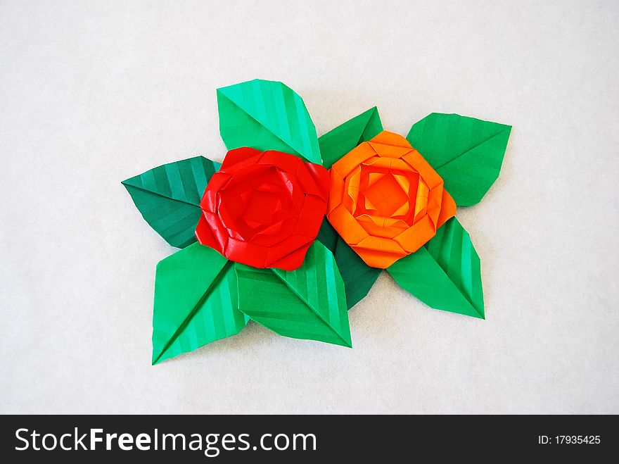 Paper flower, or origami folded and shaped in rose. Paper flower, or origami folded and shaped in rose