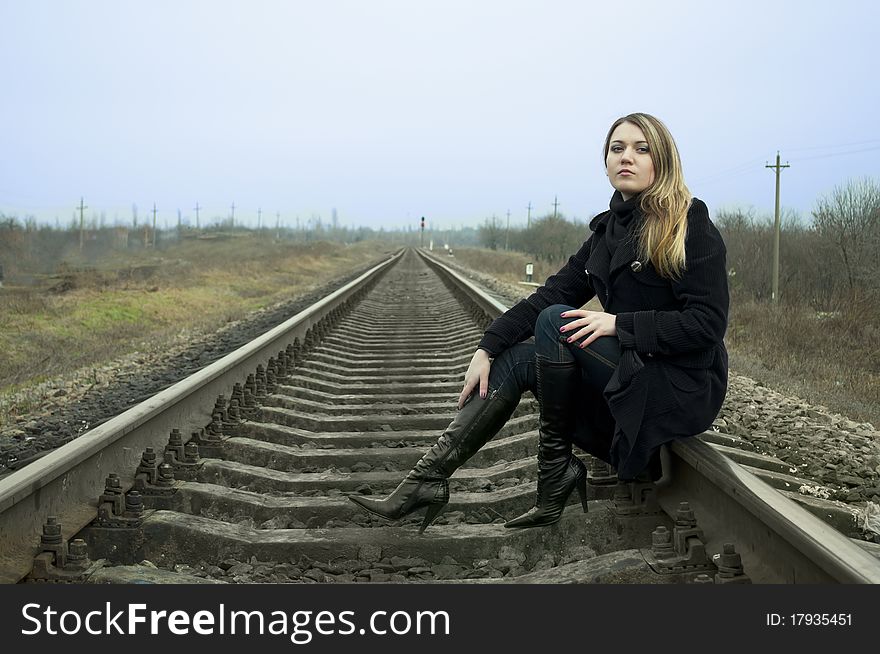 The girl waits a train