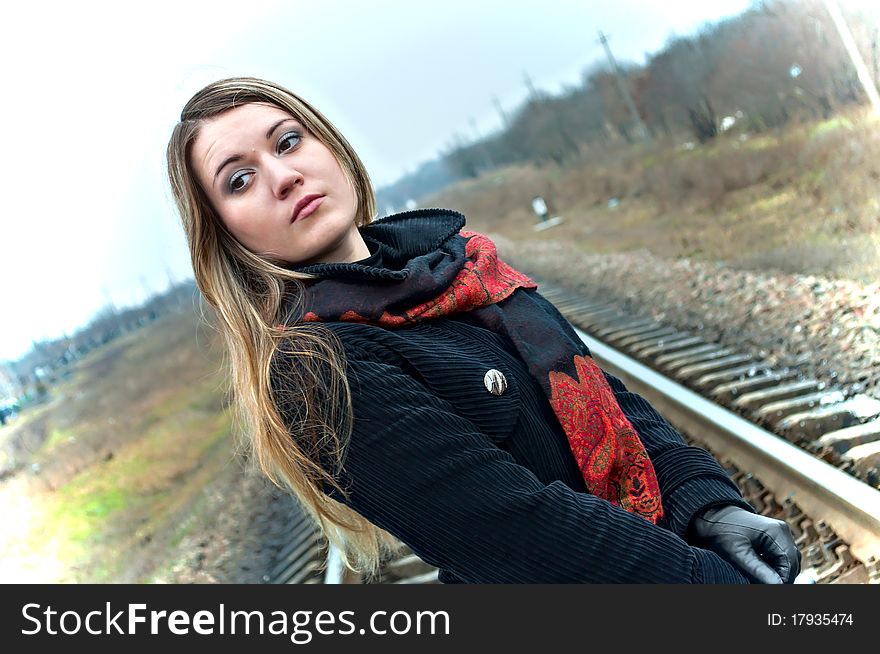 Portrait of the beautiful girl against the railway. Portrait of the beautiful girl against the railway