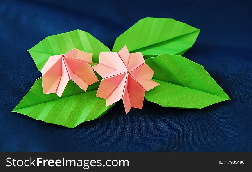 Paper flower, or origami folded and shaped in sakura. Paper flower, or origami folded and shaped in sakura