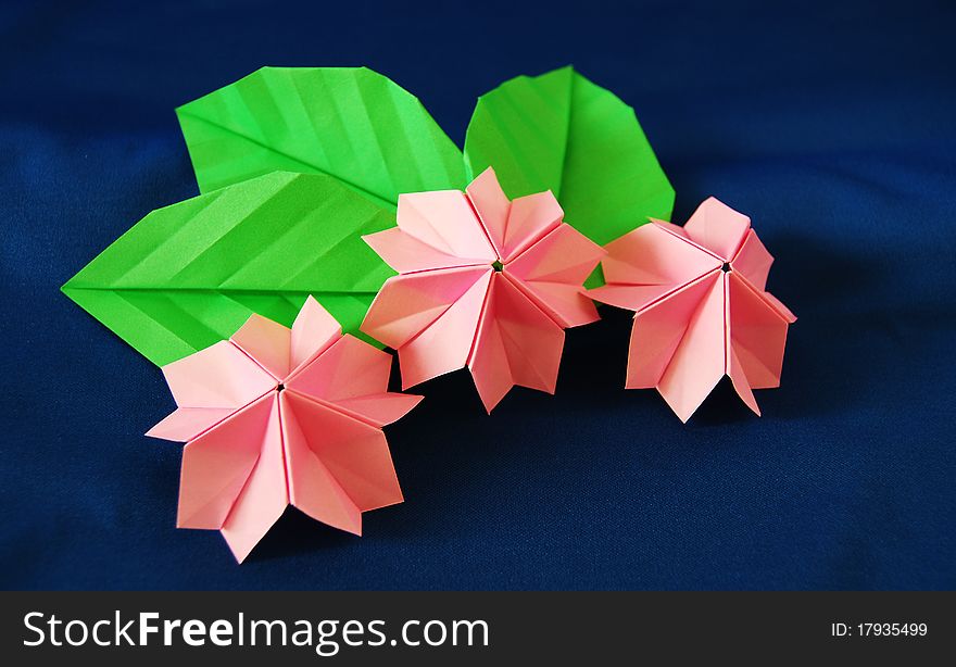 Paper flower, or origami folded and shaped in sakura. Paper flower, or origami folded and shaped in sakura