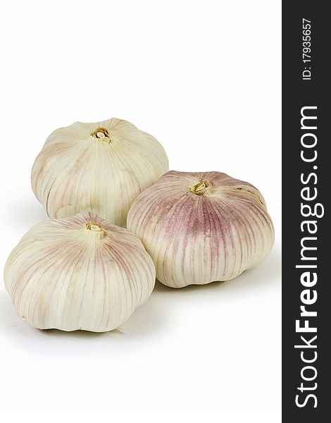 Three garlic on a white background