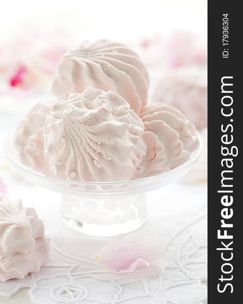 Pink sweet meringues in glass