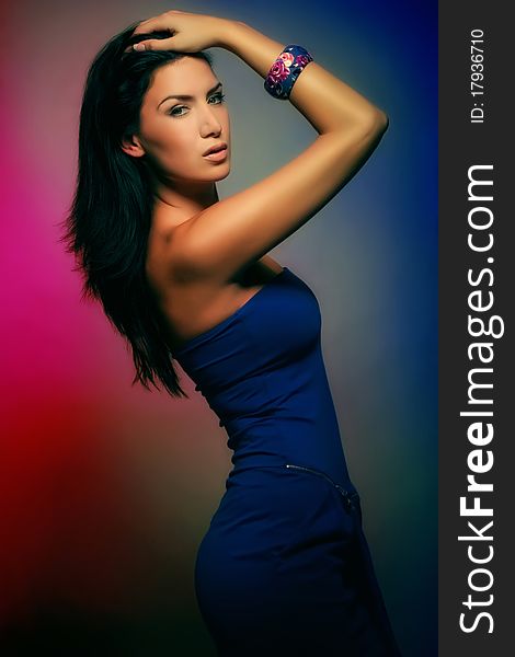 Attractive colorful brunette girl in blue dress