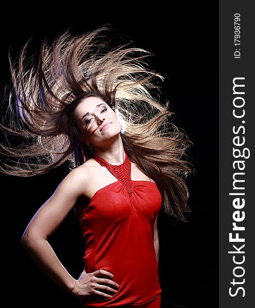 Young Woman with Windswept Hair on blue background