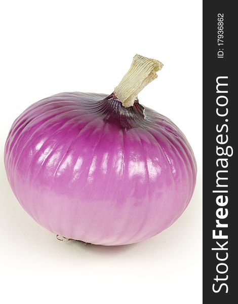 Single red onion on a white background