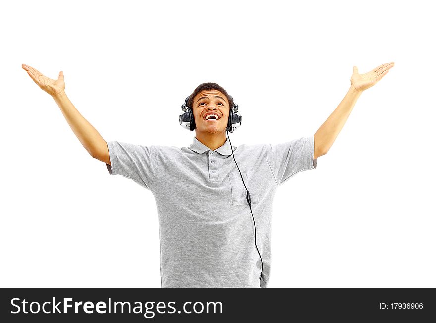 Young happy man listening to music and singing