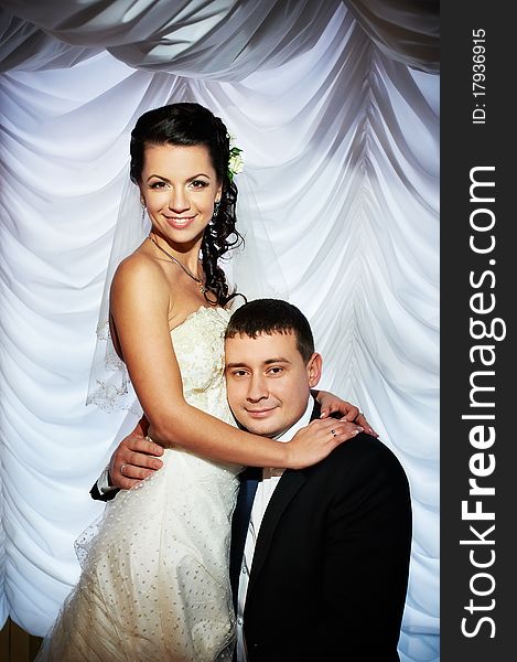 Happy bride and groom on wedding photo shoot