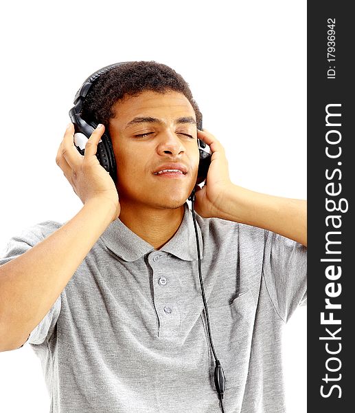 Young happy man listening to music