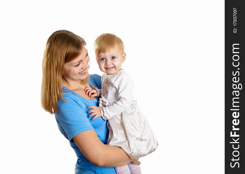 Young mother having fun with her little son on the floor