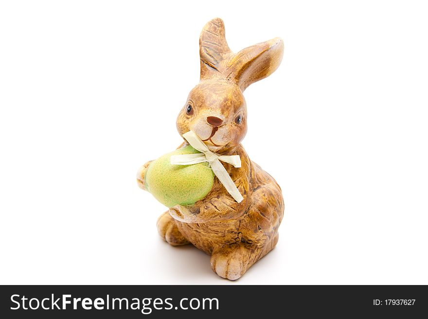 Easter bunny from ceramics with egg