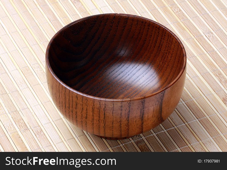 Wooden bowls, close-up on the bamboo curtain