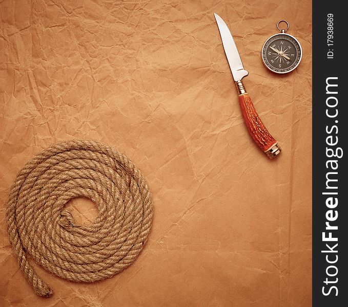 Hunting knife, rope and compass