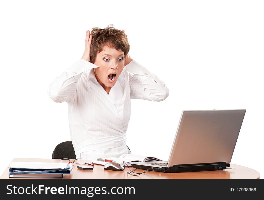 Beautiful businesswoman working with laptop at her office