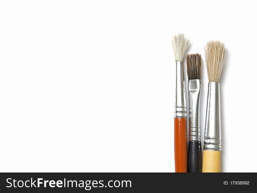 Three artist's brush on a white sheet. Three artist's brush on a white sheet