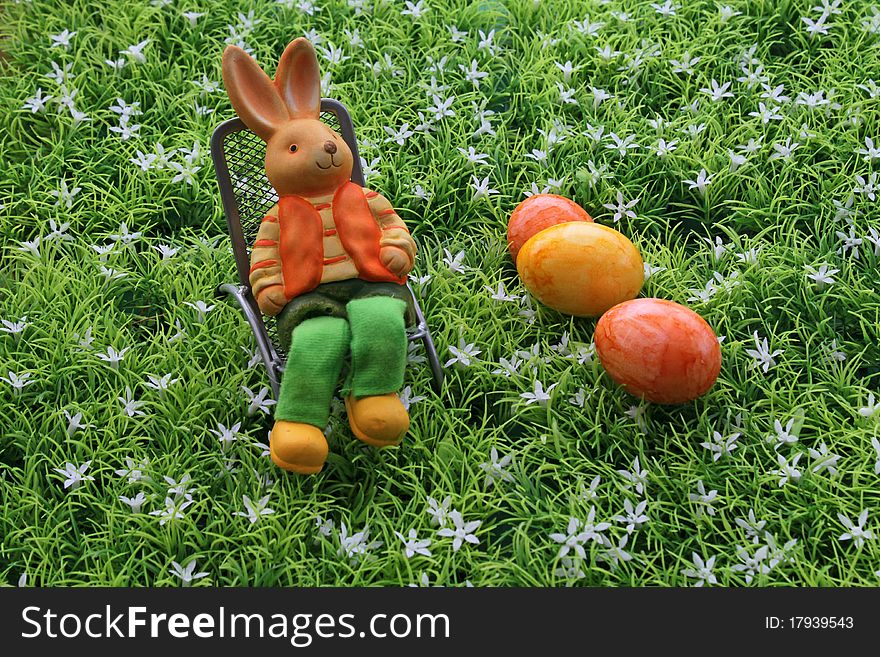 Easter eggs and an Easter bunny in the deck chair. Easter eggs and an Easter bunny in the deck chair