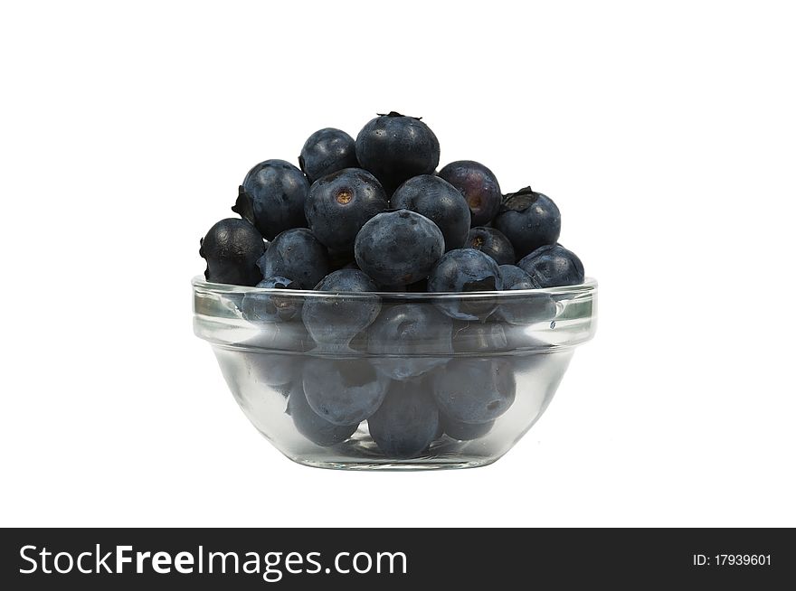 A bowl of fresh blueberries, isolated on a white background