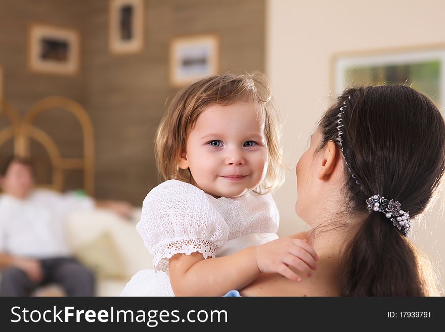 Young mother with a little daughter together at home. Young mother with a little daughter together at home