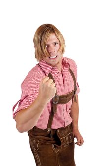 Aggressive Bavarian In Leather Trousers Shows Fist Stock Images Aggressive Bavarian In Leather Trousers Shows Fist Stock Images