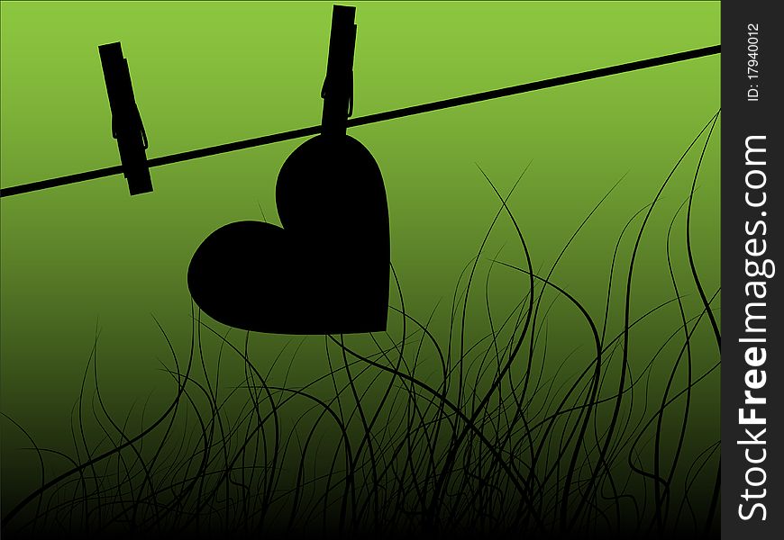 Paper heart drying on the rope with clothes peg - green