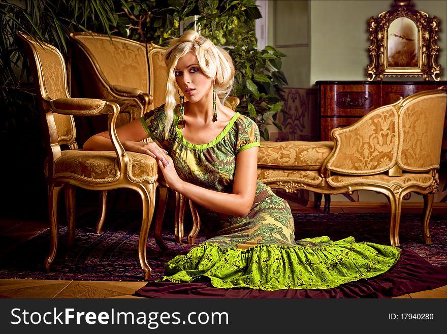Majestic attractive blond girl in castle furniture. Majestic attractive blond girl in castle furniture