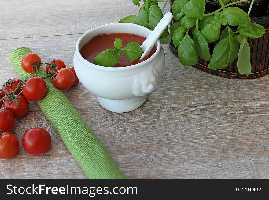 Vegetarian cuisine with basil and tomato soup