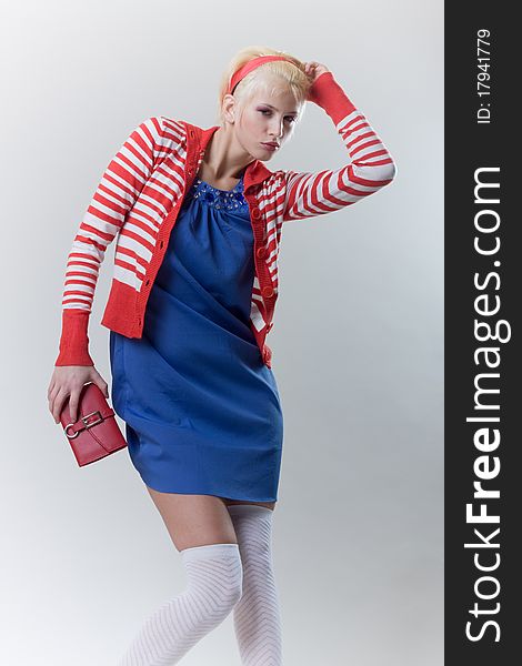 Emotion pose blond girl in red strip woolly