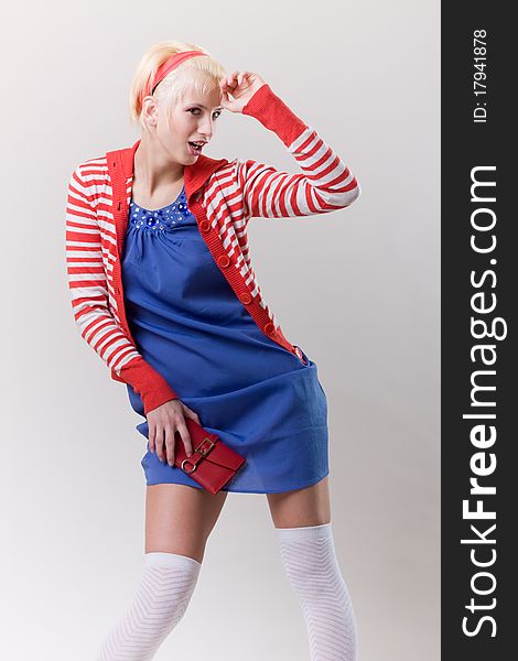 Emotion pose blond girl in red strip woolly