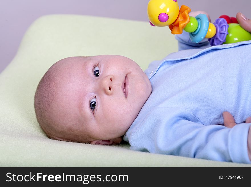 Mother plays with two months old baby boy. Mother plays with two months old baby boy.