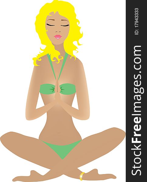 A woman in a green bikini meditating. A woman in a green bikini meditating