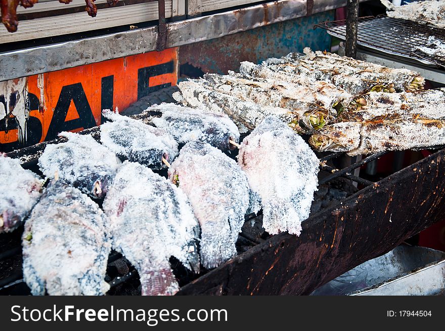 Grilled fish on stove for sale