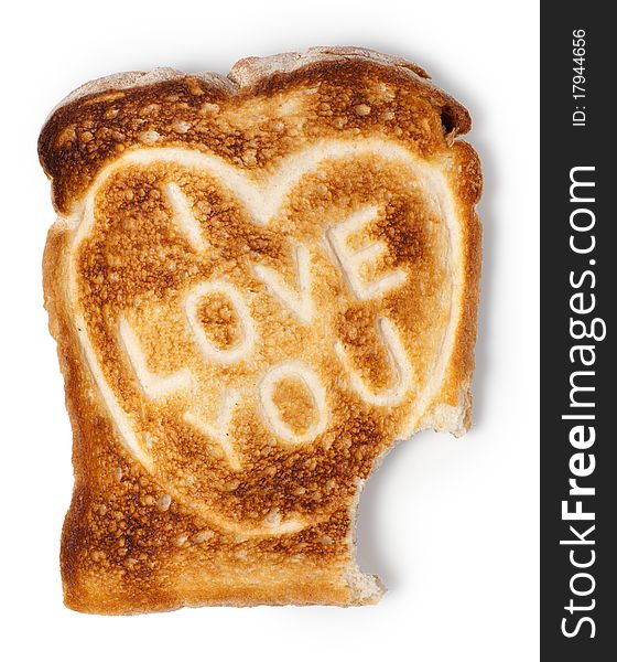 Toasted bread with love message and bite. Isolated on white. Clipping path. Toasted bread with love message and bite. Isolated on white. Clipping path.