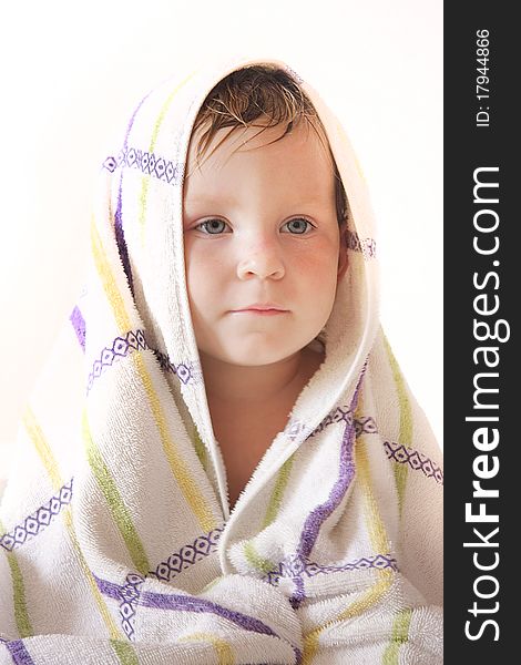 Portrait of cute child in towel