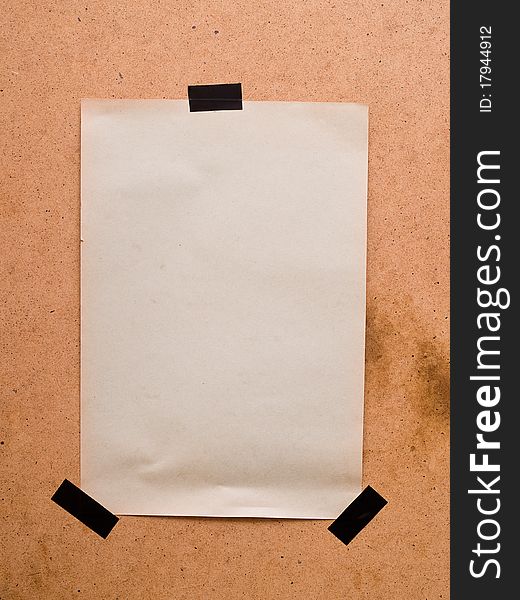 Old paper pinned on a wooden background. Old paper pinned on a wooden background