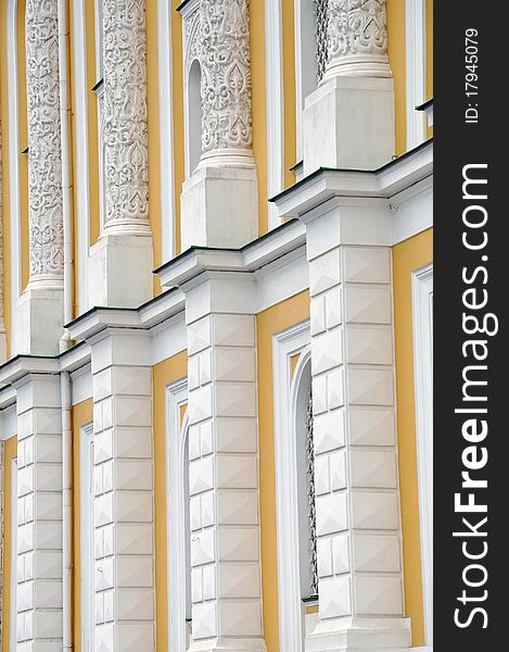 Facade of age-old house with grates on windows