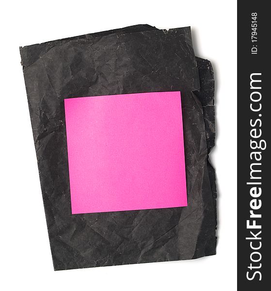 Pink stickers stuck on black paper