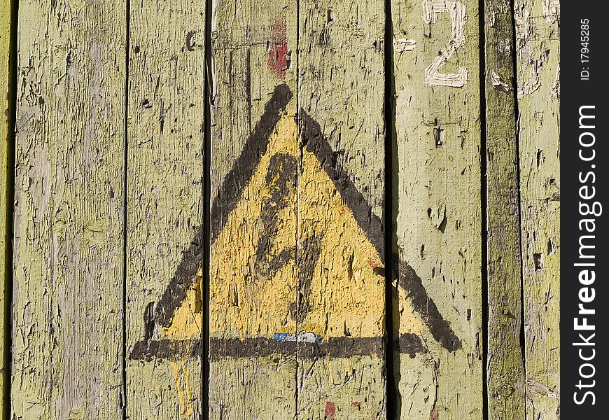 Sign--High voltage--on old wooden wall. Sign--High voltage--on old wooden wall