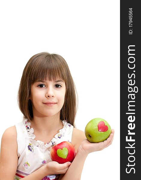 The little girl has control over two apples. The little girl has control over two apples