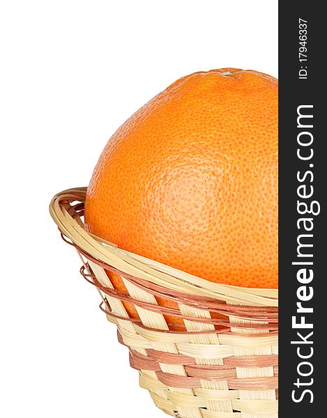 Grapefruit in the basket isolated on a white background